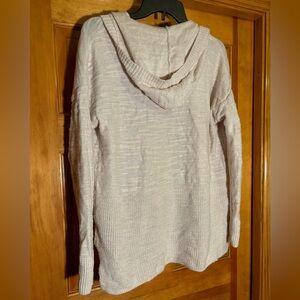 Hooded cream light oatmeal cardigan with slits on side pockets in front textured